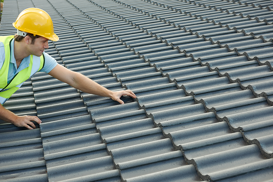Builder Working On Roof Of New Building Lifespan of your Roof